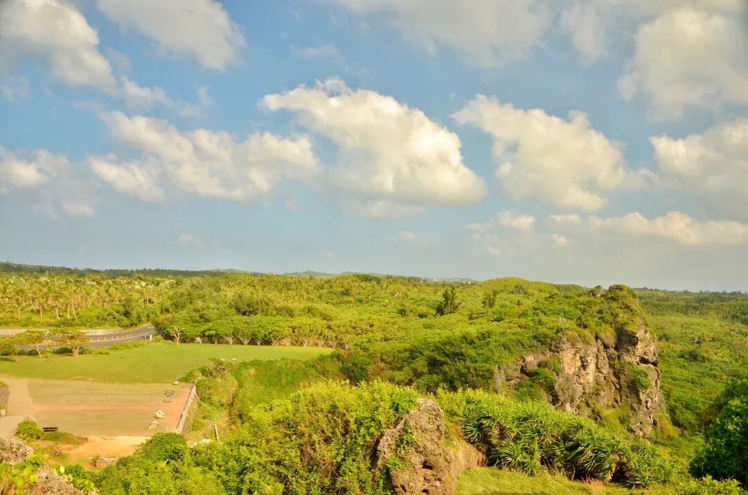 Tourists observing the scenic views and unique rock formations at Maobitou Park