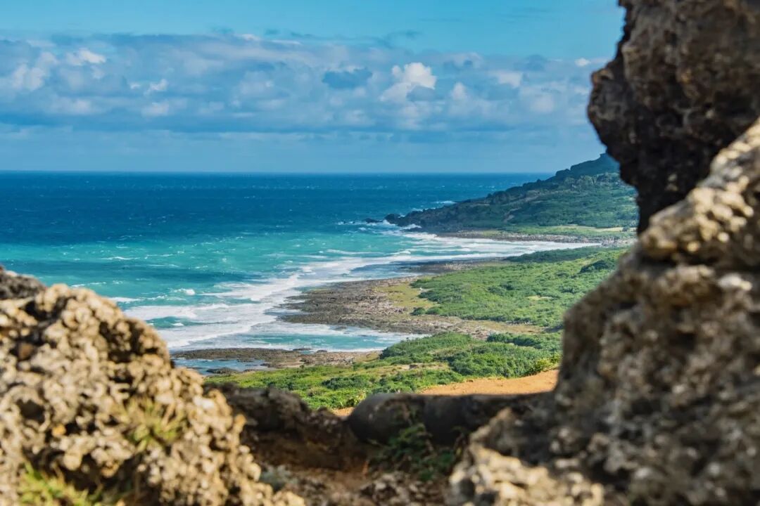 Kenting National Park coastline with green hills