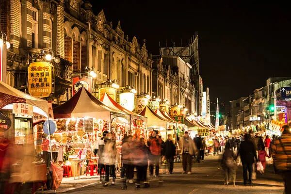 Tainan Xinhua Old Street, a vibrant Taiwanese Lunar New Year market scene with Baroque architecture