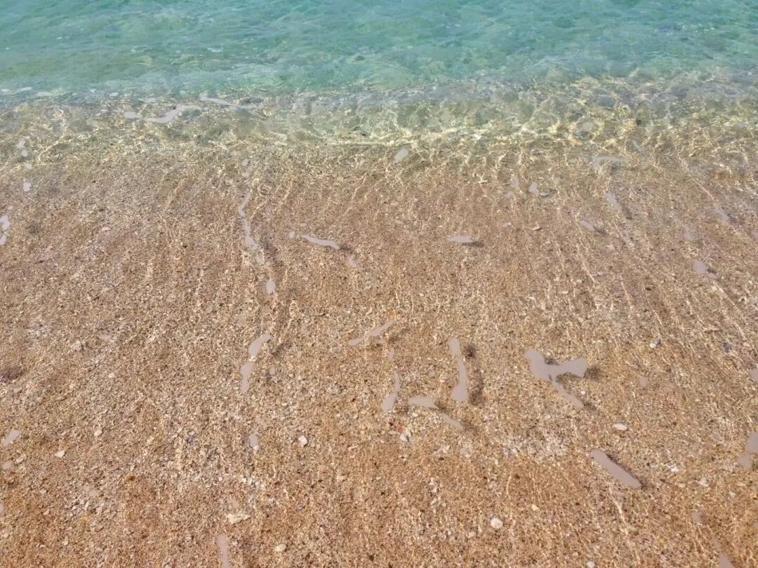 Incredibly clear ocean water at Baishawan Beach, showing off its pristine quality