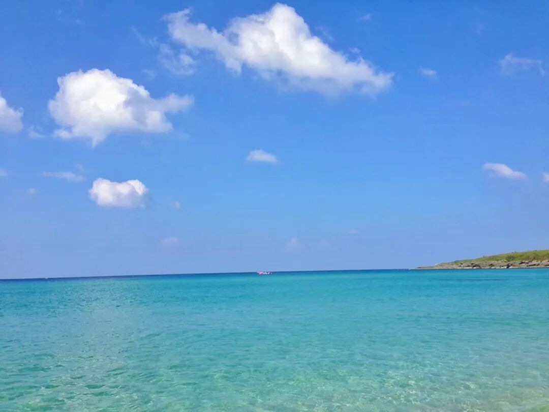 Crystal-clear shallow waters of Baishawan Beach, perfect for swimming and wading