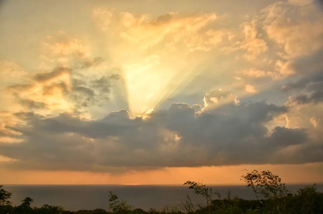 Beautiful orange and pink hues dominating the Guanshan sunset sky, with distant clouds