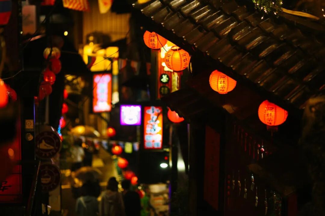 Lively Jiufen Old Street. A vibrant, narrow street in Jiufen, bustling with activity.