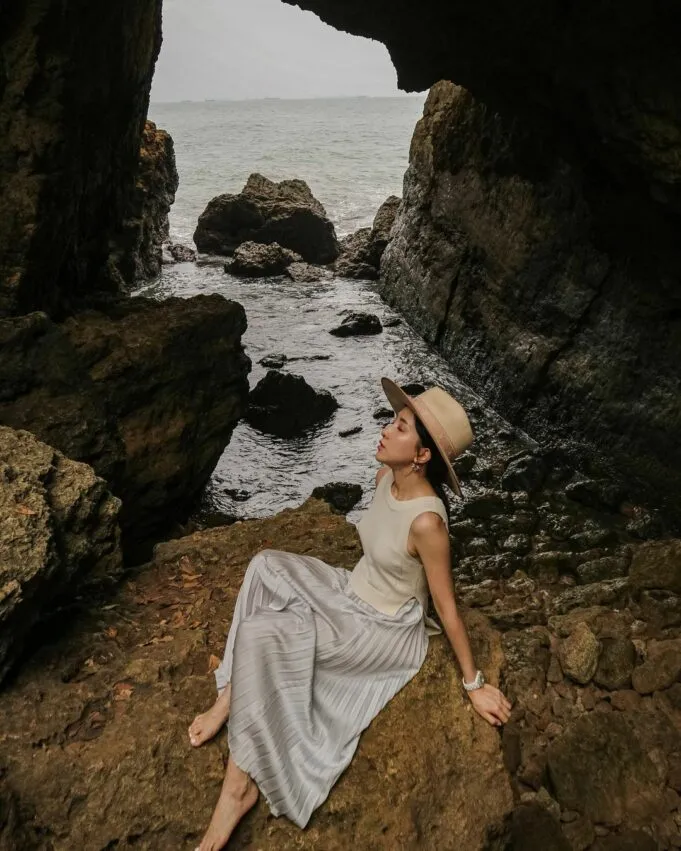 Visitors exploring the sea cave at low tide