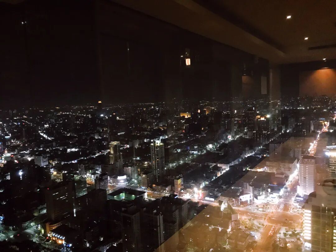 Ships docked in Kaohsiung Port with city skyline