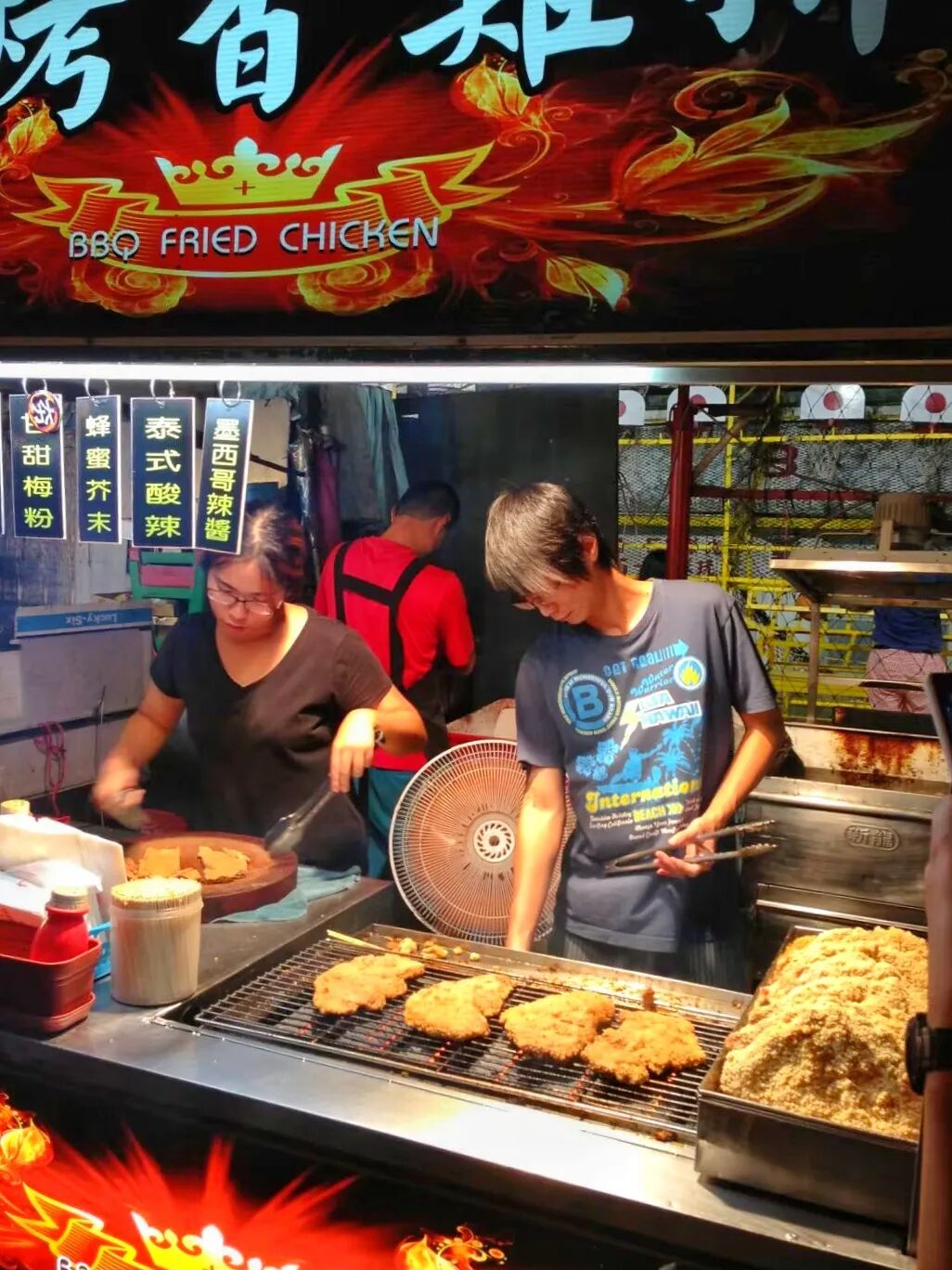 Close-up of grilled skewers being cooked at a food stall in Kenting Night Market