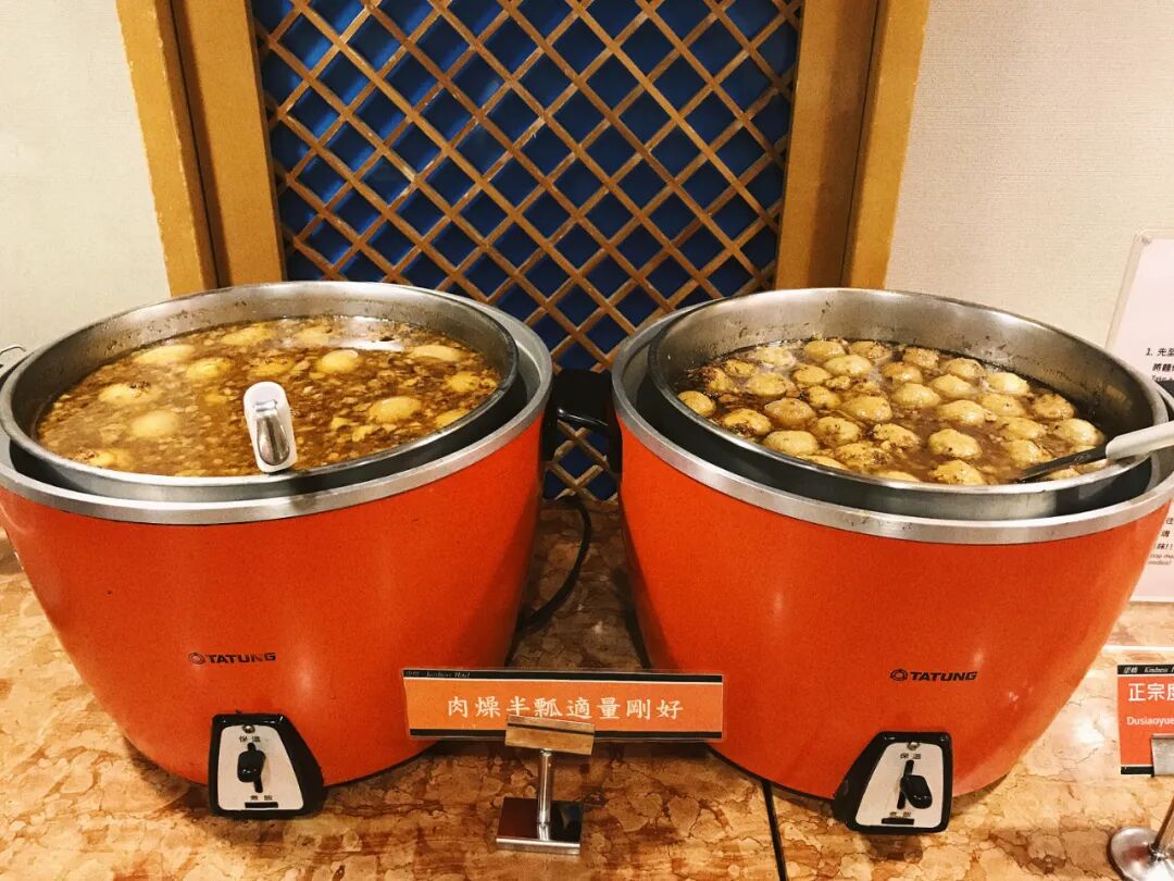 Variety of fresh fruits available at a hotel buffet, a healthy dessert option.