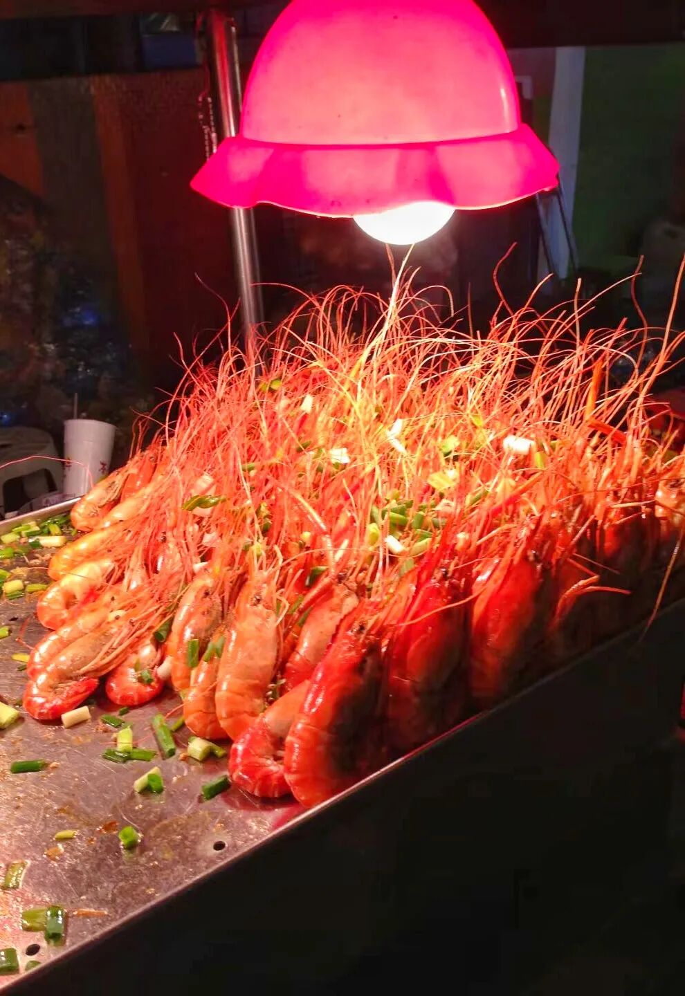 Street vendors preparing and selling various local snacks at Kenting Night Market