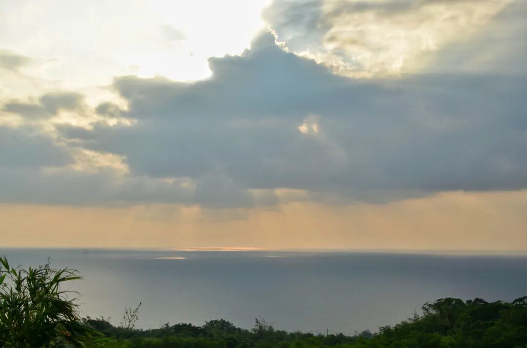 Vibrant sunset sky over Guanshan, with clouds painted in fiery orange and gold