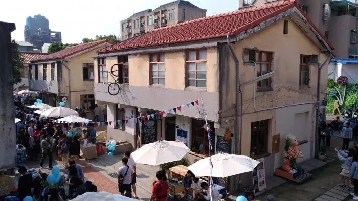 Shen Ji New Village: Hip Boutiques & Sweet Treats Charming alleyway in Shen Ji New Village with small shops and cafes