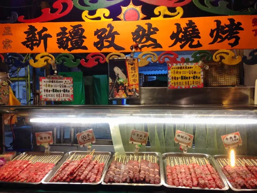 Lively Kenting Street Night Market, bustling with food stalls and people