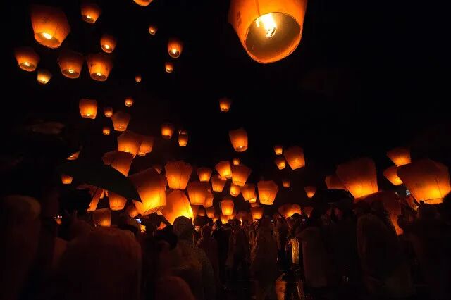 People releasing colorful sky lanterns at Shifen Old Street, Taiwan