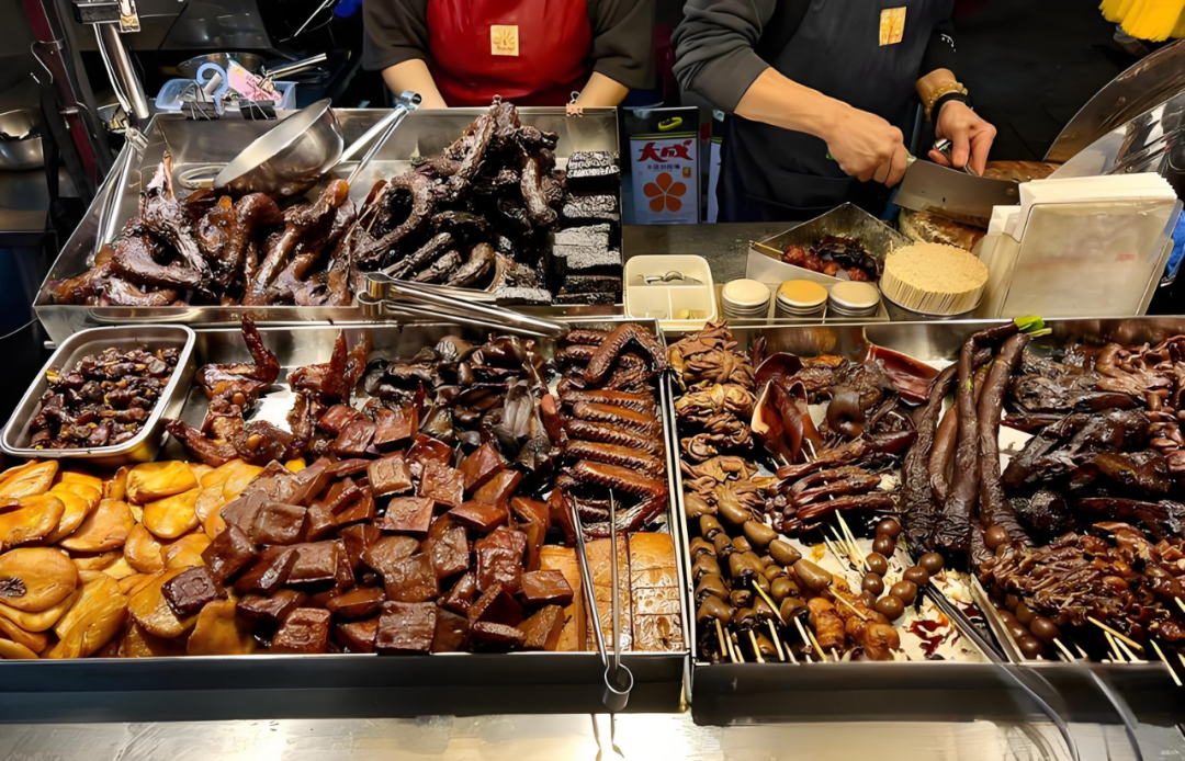 A feast of authentic Ningxia Night Market street food favorites Assortment of popular Taiwanese street food, including grilled beef and Dongshan Duck Head